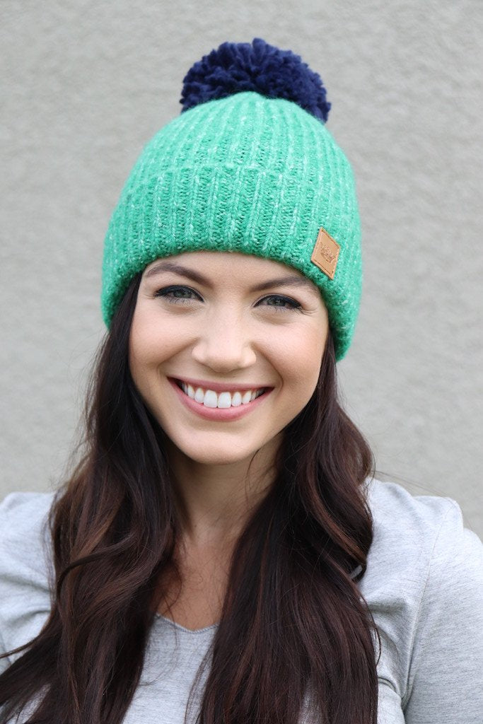 Green Fleece lined knit hat with navy pom